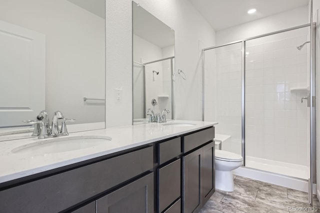 1974 S Haleyville Way, Aurora, CO 80018 - full bathroom with a shower stall, double vanity, and toilet