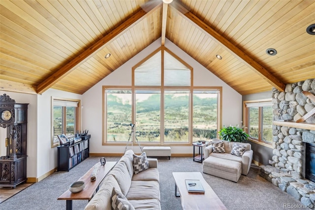 50 Spinning Leaf Trl, Silverthorne, CO 80498 - carpeted living area featuring a stone fireplace, wood ceiling, and baseboards