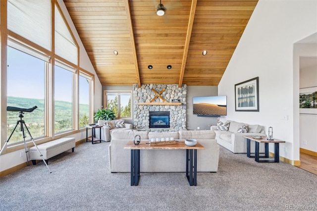 50 Spinning Leaf Trl, Silverthorne, CO 80498 - living room featuring wooden ceiling with exposed beams, carpet flooring, baseboards, a fireplace, and high vaulted ceiling