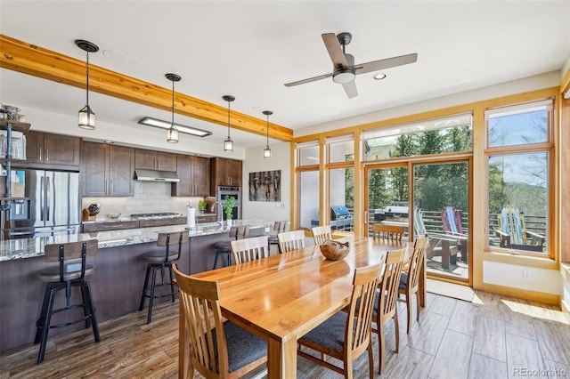 50 Spinning Leaf Trl, Silverthorne, CO 80498 - dining area with a ceiling fan, light wood finished floors, and beam ceiling