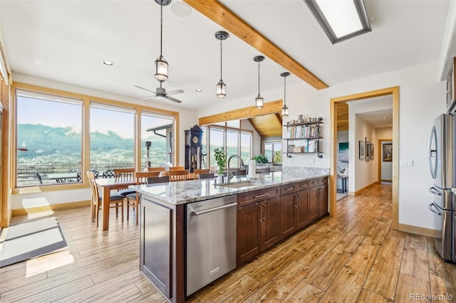 50 Spinning Leaf Trl, Silverthorne, CO 80498 - kitchen with stainless steel appliances, ceiling fan, dark brown cabinetry, light wood finished floors, and a sink