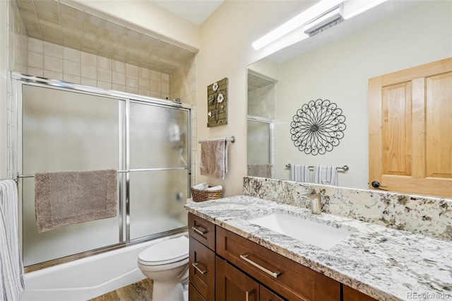 50 Spinning Leaf Trl, Silverthorne, CO 80498 - full bath with vanity, toilet, combined bath / shower with glass door, and wood finished floors