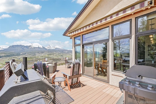 50 Spinning Leaf Trl, Silverthorne, CO 80498 - wooden terrace with a mountain view, a grill, and outdoor dining space