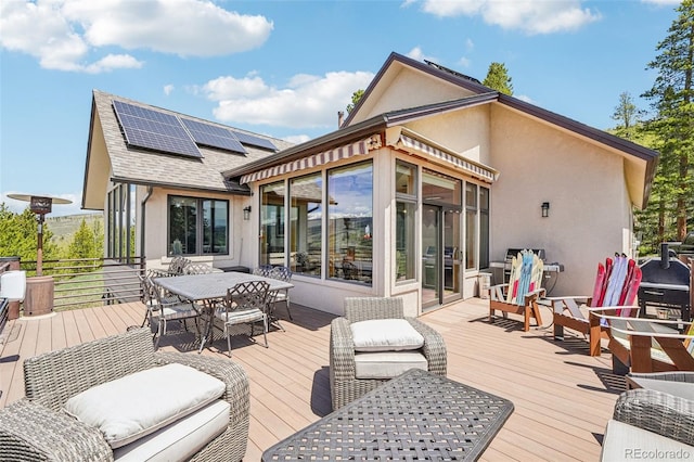 50 Spinning Leaf Trl, Silverthorne, CO 80498 - wooden deck with outdoor dining space, a sunroom, and area for grilling