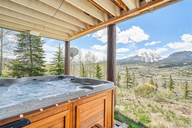 50 Spinning Leaf Trl, Silverthorne, CO 80498 - view of patio / terrace with a hot tub and a mountain view