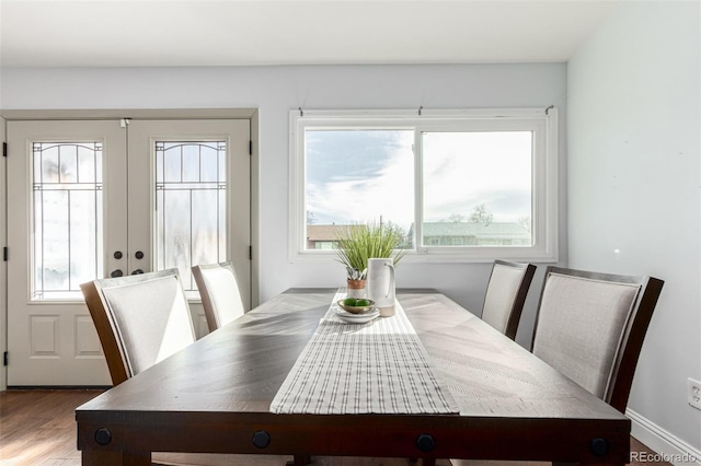 1451 S Quitman St, Denver, CO 80219 - dining area featuring a wealth of natural light, french doors, and wood finished floors
