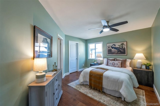 1451 S Quitman St, Denver, CO 80219 - bedroom with dark wood-style flooring, baseboards, and a ceiling fan