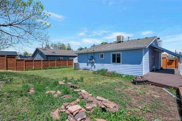 1451 S Quitman St, Denver, CO 80219 - rear view of property featuring a wooden deck, a chimney, and central air condition unit