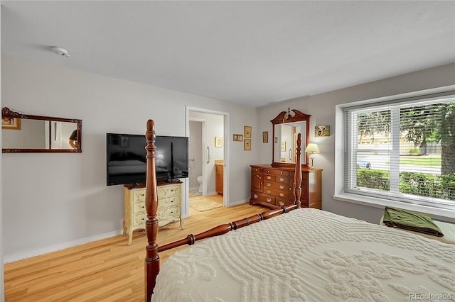 6425 W Frost Dr, Littleton, CO 80128 - bedroom with light wood-type flooring and ensuite bathroom