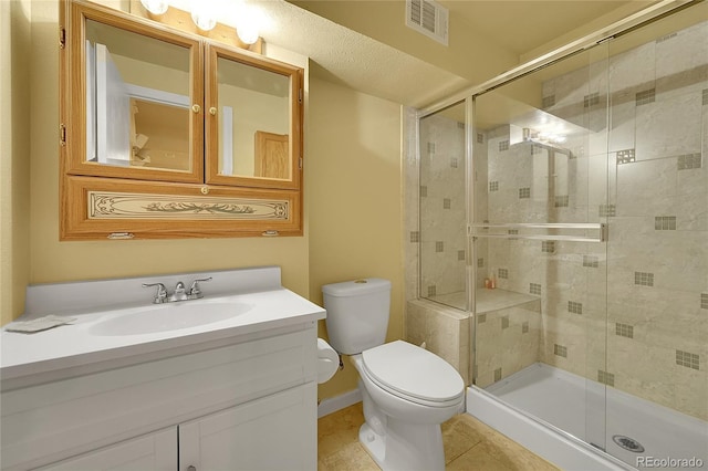 6425 W Frost Dr, Littleton, CO 80128 - bathroom with tile patterned flooring, a stall shower, and vanity