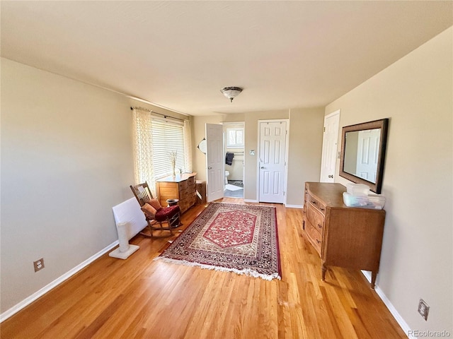 foyer featuring light wood-type flooring and baseboards