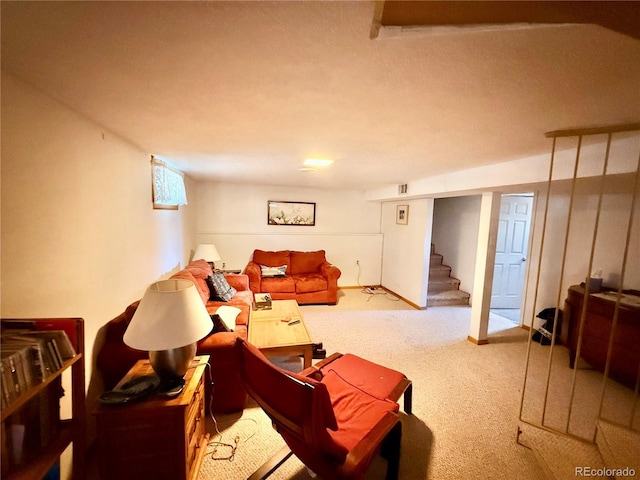 living room with stairs and carpet flooring