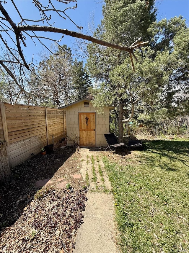 view of shed featuring a fenced backyard