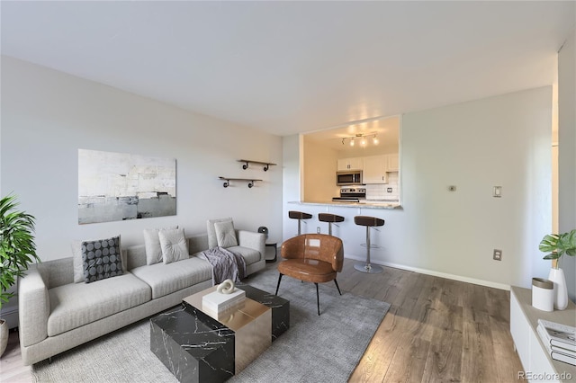 1008 N Corona St Unit 403, Denver, CO 80218 - living room featuring wood finished floors and a chandelier