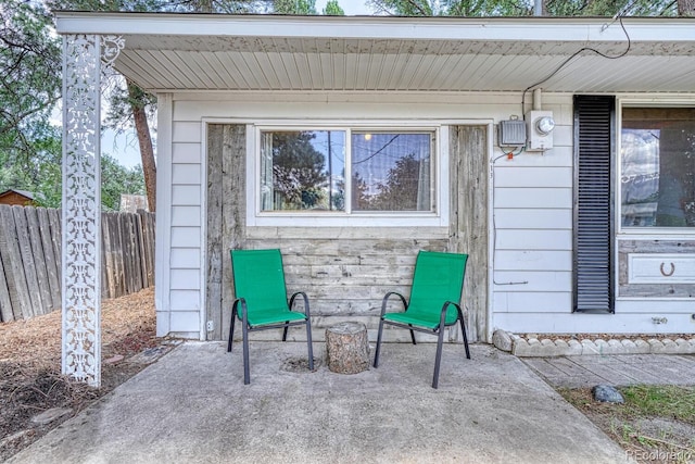view of patio featuring fence