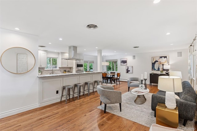 3190 S Detroit St, Denver, CO 80210 - living area featuring light wood-style floors and recessed lighting