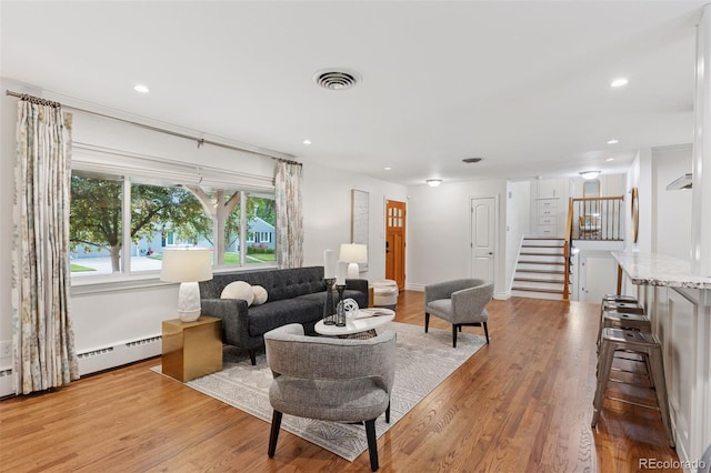 3190 S Detroit St, Denver, CO 80210 - living room with stairs, light wood-style floors, recessed lighting, and a baseboard heating unit