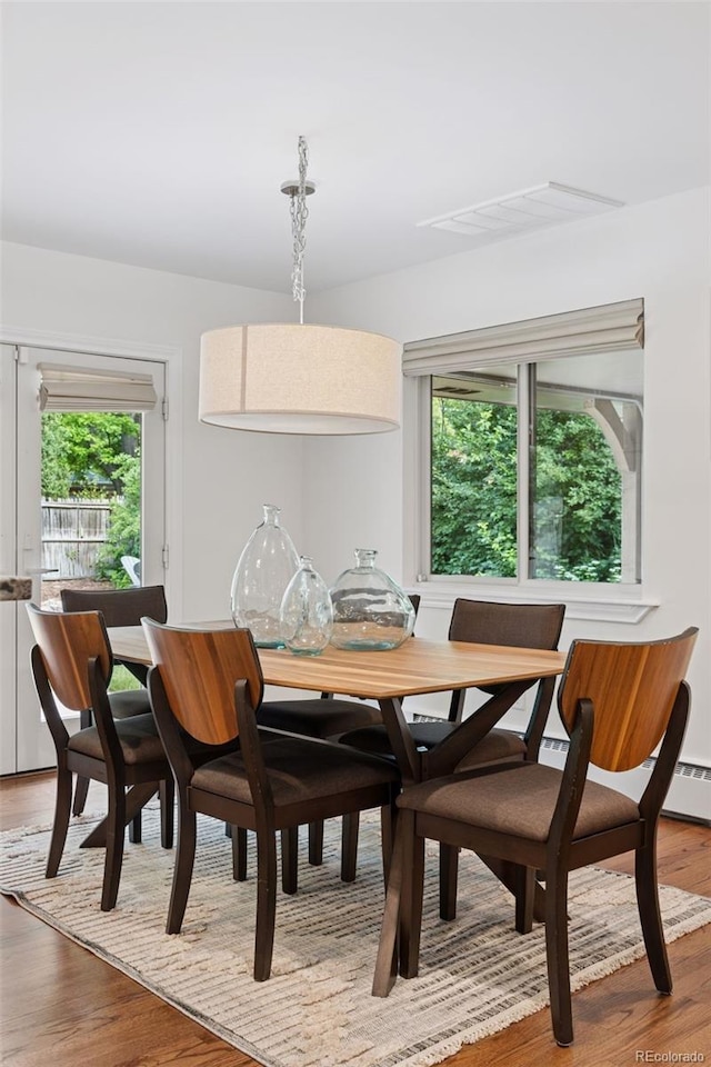 3190 S Detroit St, Denver, CO 80210 - dining area with plenty of natural light and light wood-type flooring