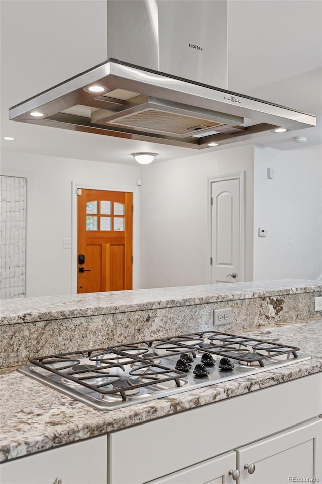3190 S Detroit St, Denver, CO 80210 - kitchen featuring white cabinets and stainless steel gas cooktop