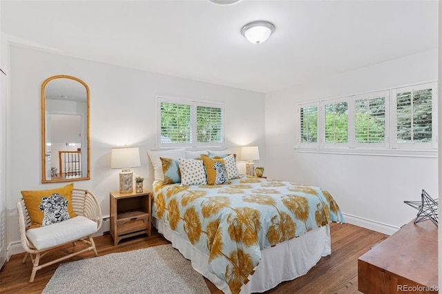 3190 S Detroit St, Denver, CO 80210 - bedroom with multiple windows and wood finished floors