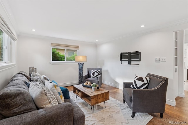 3190 S Detroit St, Denver, CO 80210 - living area featuring crown molding, a baseboard heating unit, light wood-type flooring, and recessed lighting
