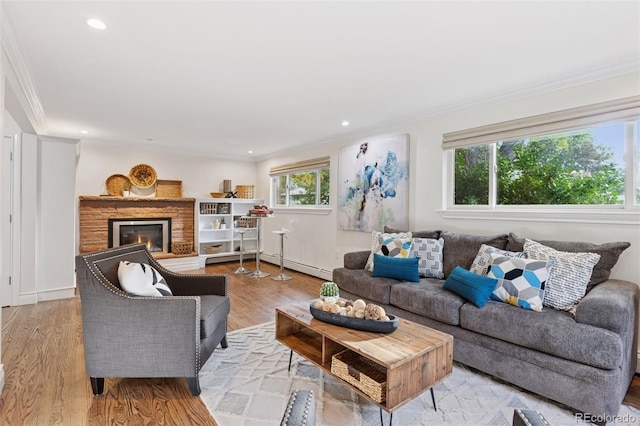 3190 S Detroit St, Denver, CO 80210 - living area with crown molding, wood finished floors, a glass covered fireplace, recessed lighting, and baseboard heating