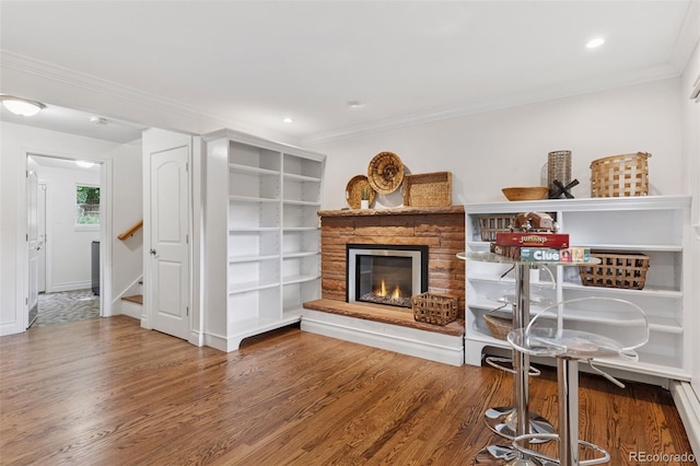3190 S Detroit St, Denver, CO 80210 - living area featuring wood finished floors, a fireplace, ornamental molding, stairs, and recessed lighting