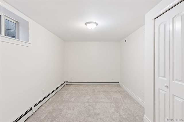 3190 S Detroit St, Denver, CO 80210 - carpeted empty room featuring a baseboard heating unit