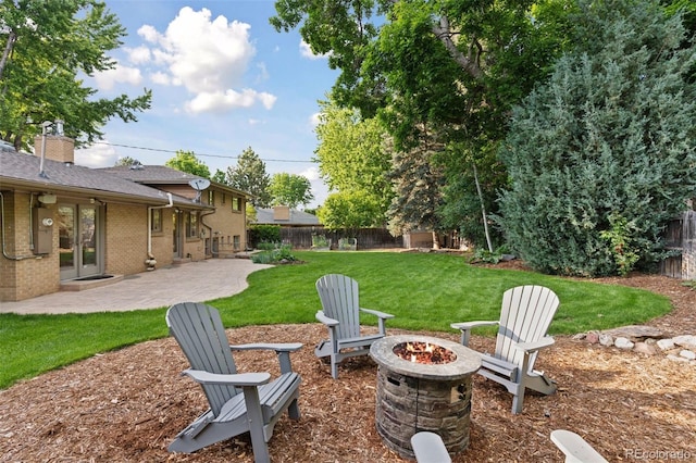 3190 S Detroit St, Denver, CO 80210 - fenced backyard with an outdoor fire pit, a patio area, and french doors