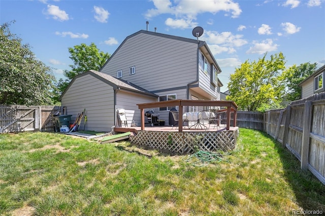 10223 Vine Ct, Thornton, CO 80229 - back of property with a fenced backyard and a wooden deck
