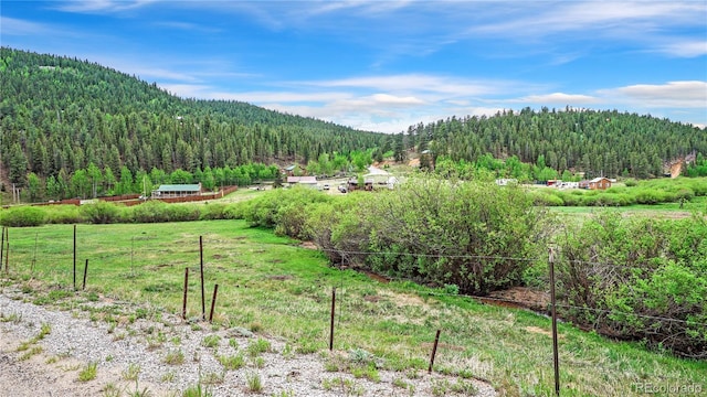 view of mountain feature with a rural view