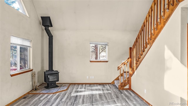 living room with hardwood / wood-style flooring and a wood stove