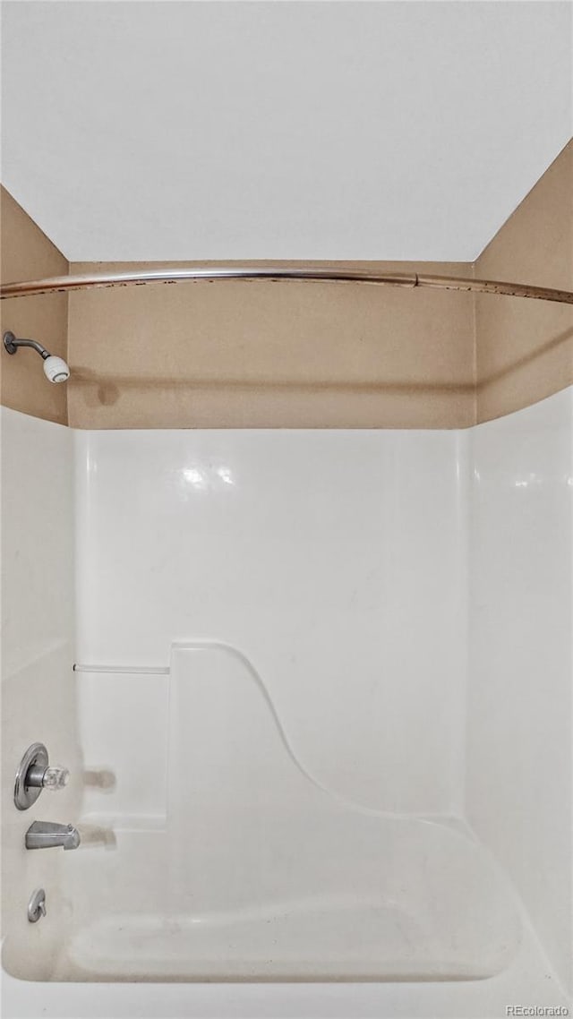 bathroom with shower / tub combination