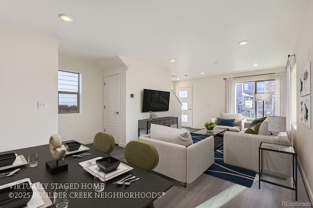 living room featuring hardwood / wood-style floors and a wealth of natural light