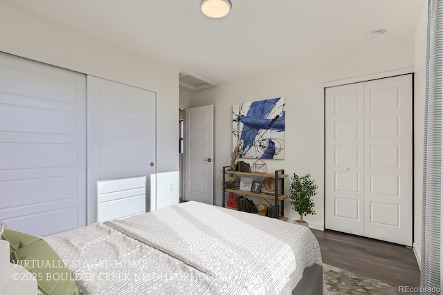 bedroom featuring a closet and dark hardwood / wood-style floors