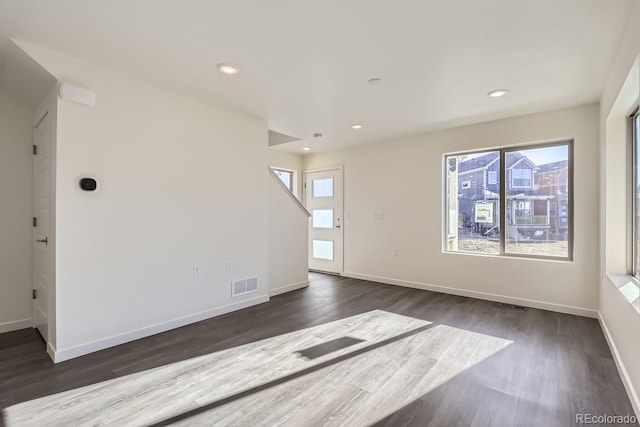 spare room featuring dark hardwood / wood-style floors