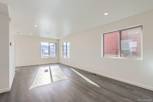 empty room featuring dark wood-type flooring