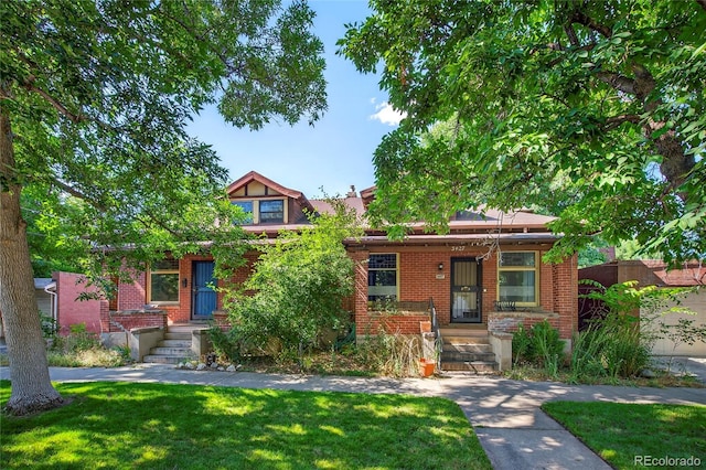 3421 E 16th Ave, Denver, CO 80206 - view of front facade with a front yard and brick siding