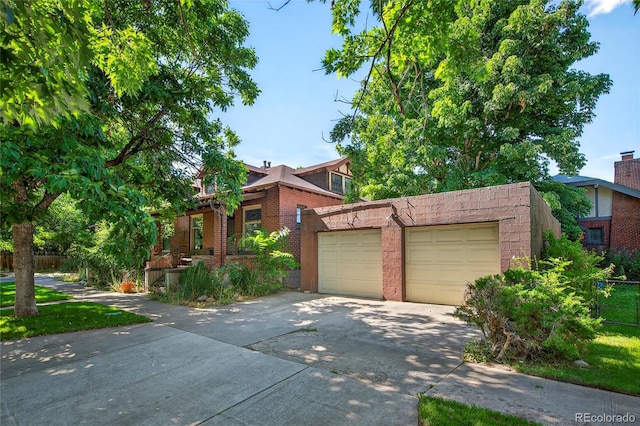 3421 E 16th Ave, Denver, CO 80206 - view of front facade with concrete driveway and brick siding