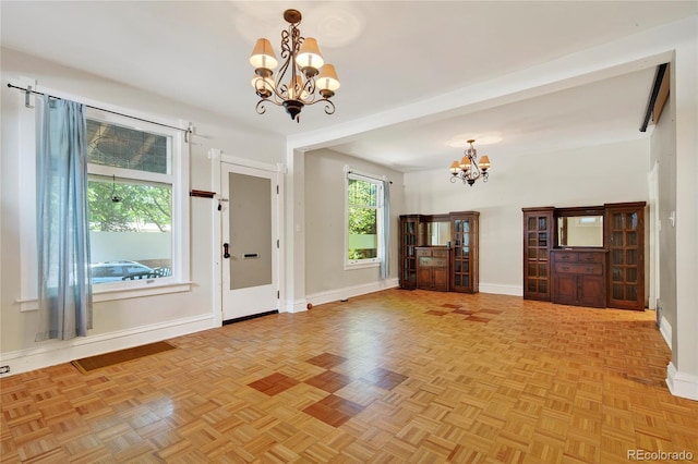 3421 E 16th Ave, Denver, CO 80206 - entrance foyer featuring a chandelier and baseboards