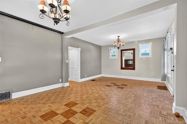 3421 E 16th Ave, Denver, CO 80206 - unfurnished room featuring a chandelier and baseboards