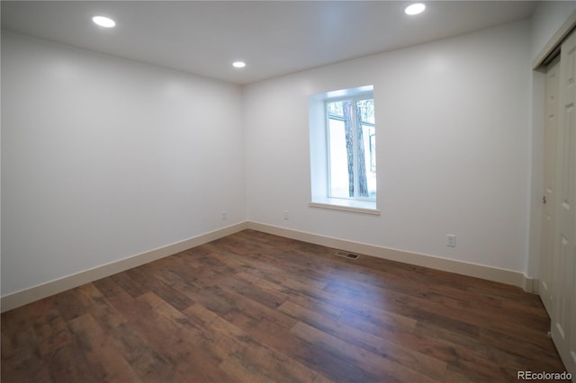 14546 Pine View Rd, Larkspur, CO 80118 - unfurnished room with dark wood-style flooring, recessed lighting, and baseboards