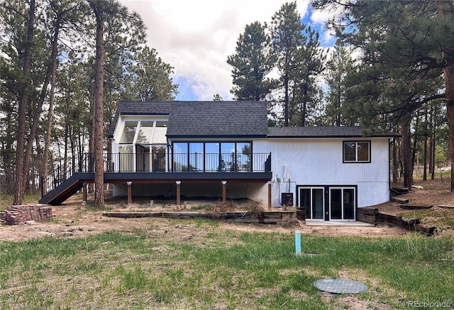 14546 Pine View Rd, Larkspur, CO 80118 - rear view of house featuring a deck, stairway, and roof with shingles
