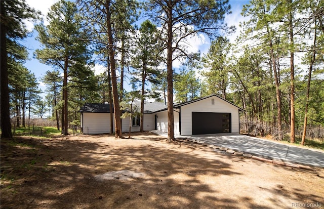14546 Pine View Rd, Larkspur, CO 80118 - view of front of home with concrete driveway and a garage