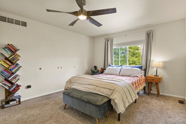 bedroom with ceiling fan and carpet floors