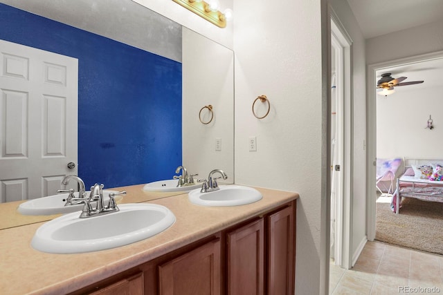 bathroom featuring tile patterned flooring, vanity, and ceiling fan