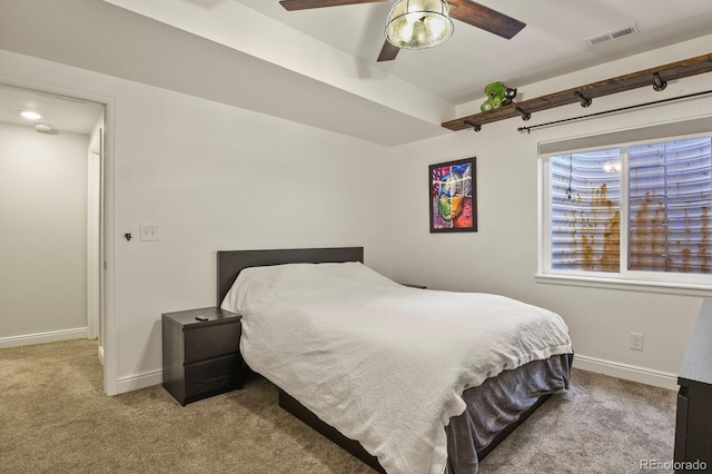 bedroom featuring light colored carpet and ceiling fan