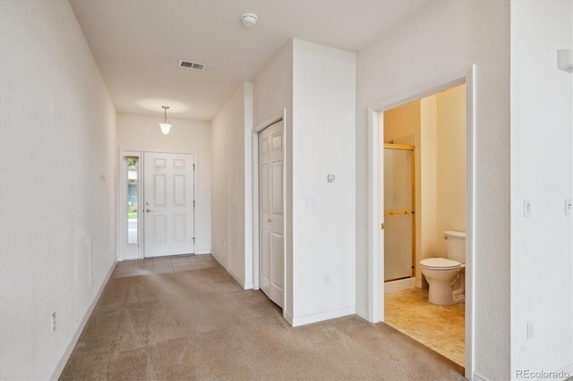 10725 Eliot Cir Unit 102, Denver, CO 80234 - hallway featuring carpet floors and baseboards