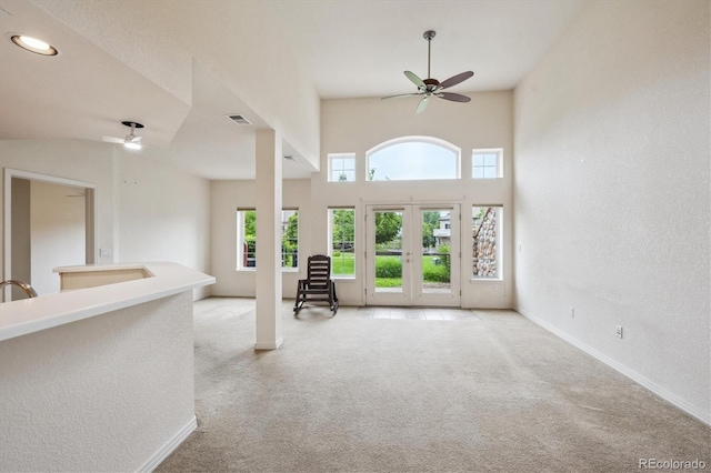 10725 Eliot Cir Unit 102, Denver, CO 80234 - carpeted empty room featuring ceiling fan, baseboards, a textured wall, and french doors