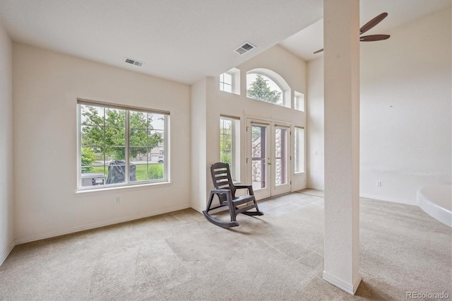 10725 Eliot Cir Unit 102, Denver, CO 80234 - living area with carpet floors, healthy amount of natural light, and french doors